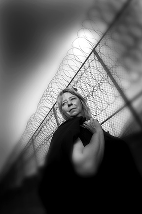 portrait of lawyer, barbed wire at jail