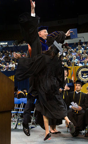 college graduation, dean gives chest bump