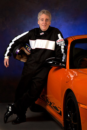 executive portrait with race car